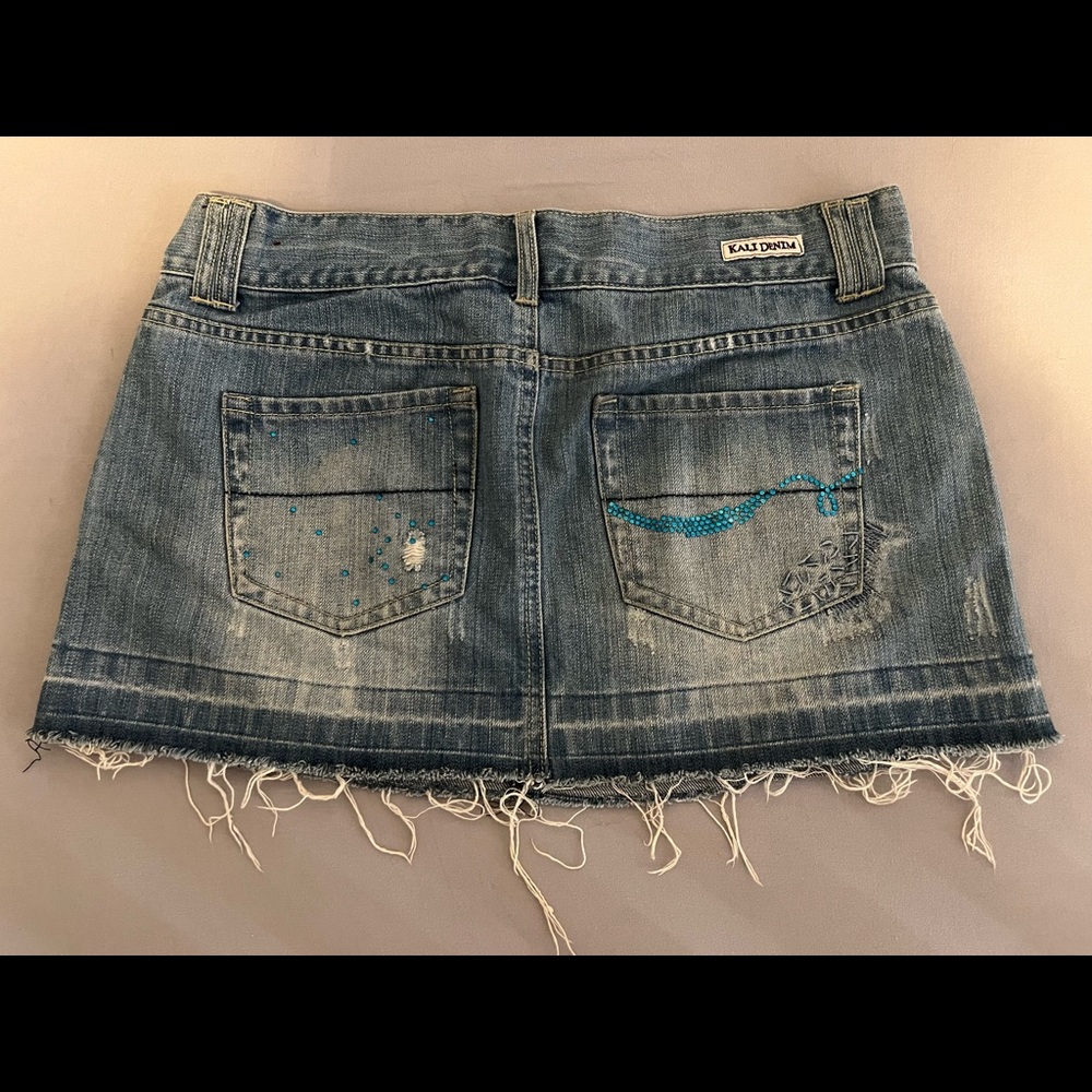 Kali Denim Skirt with blue rhinestone details on back pockets
